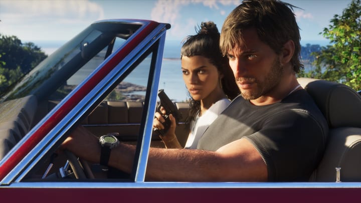 Jason au volant d'une décapotable rouge, Lucia à ses côtés, la côte en arrière-plan